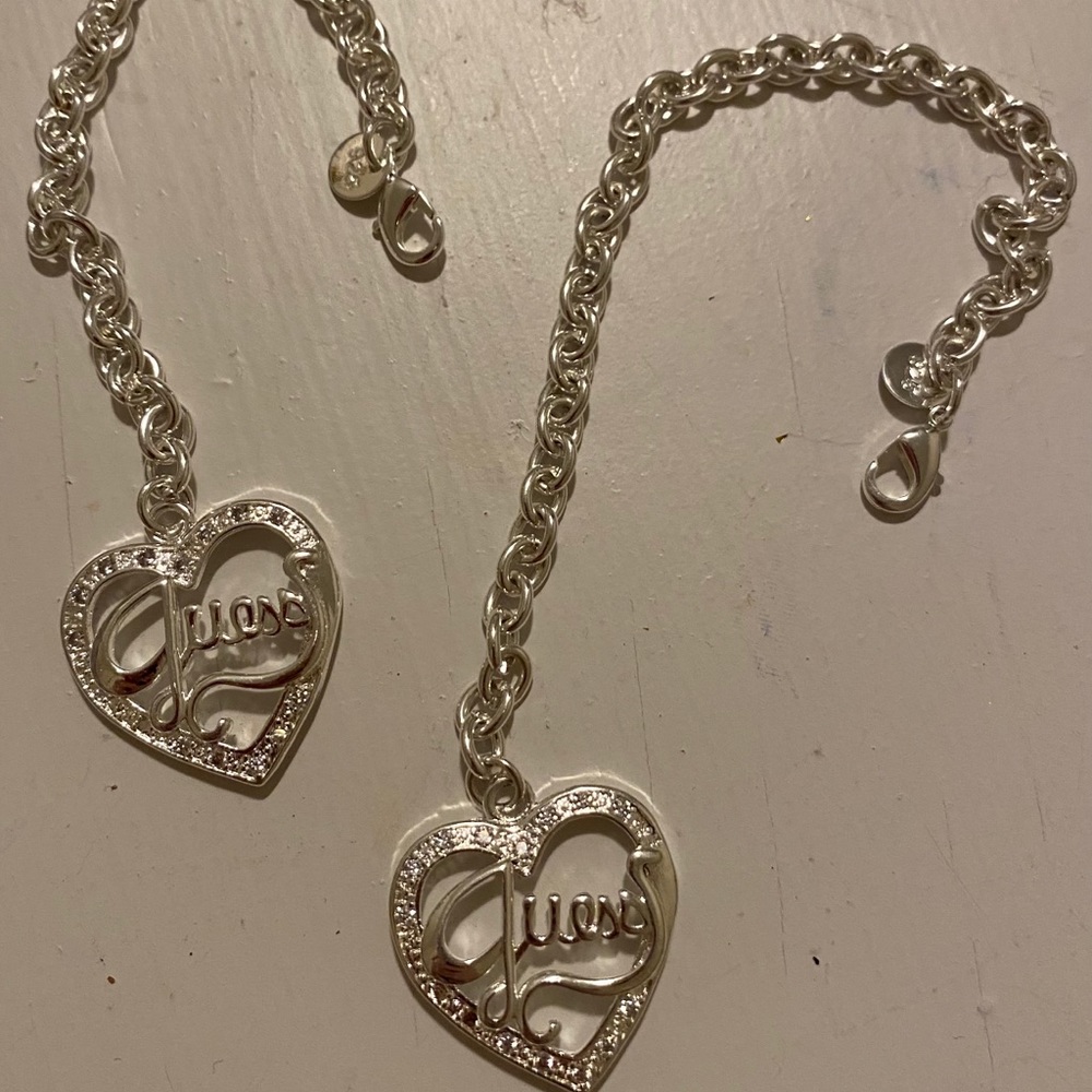 2 silver guess bracelets